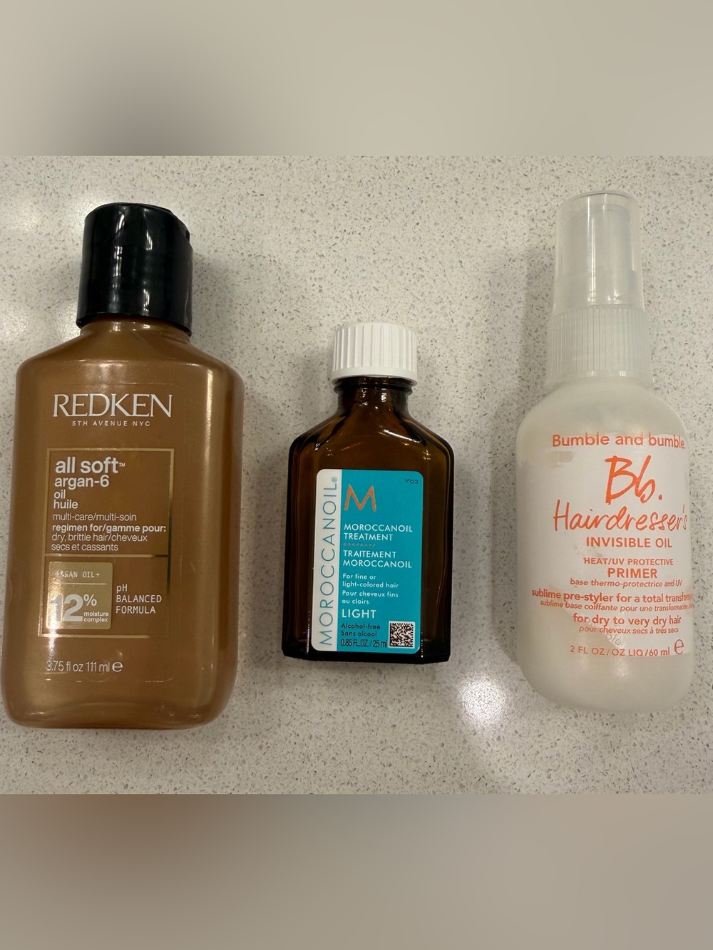 Moroccanoil, Redken oil, Bumble and Bumble oil trio travel set